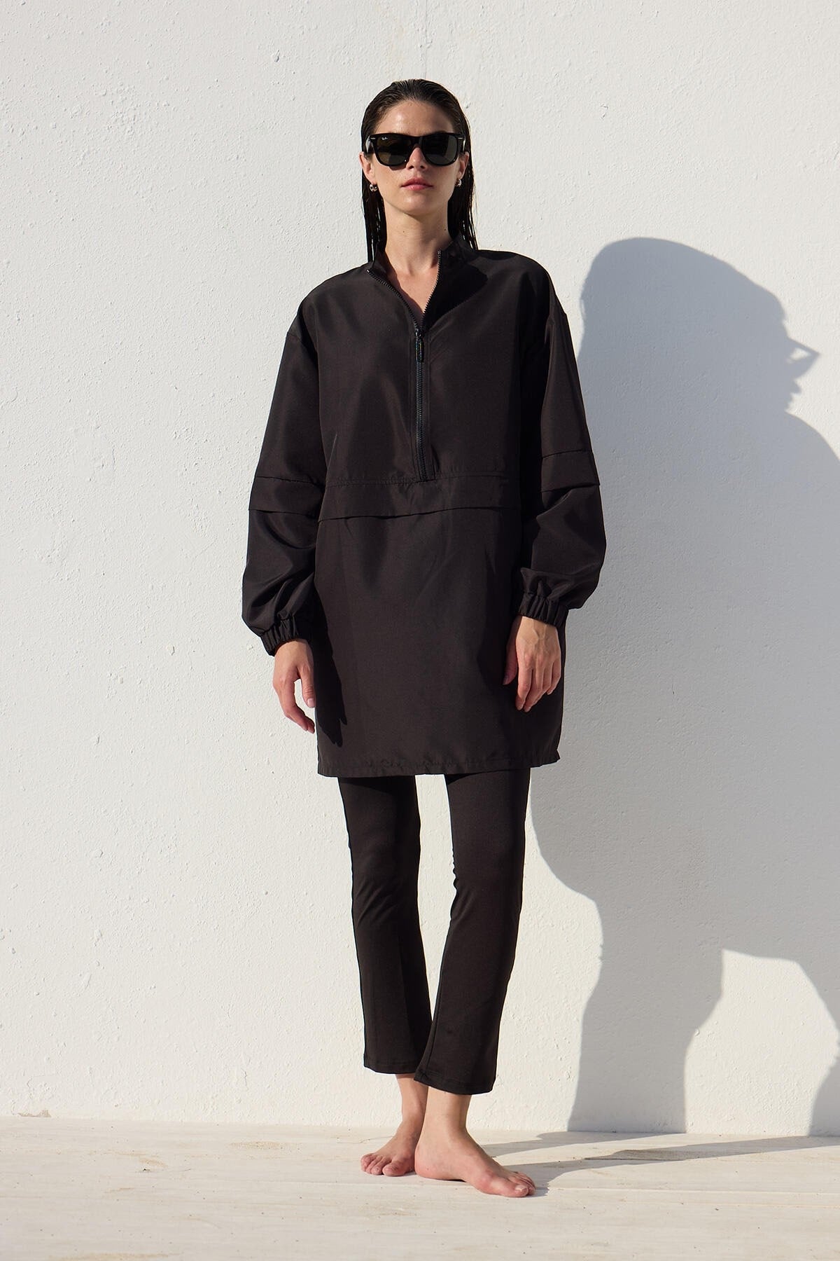 Black one-piece athletic parachute swimsuit