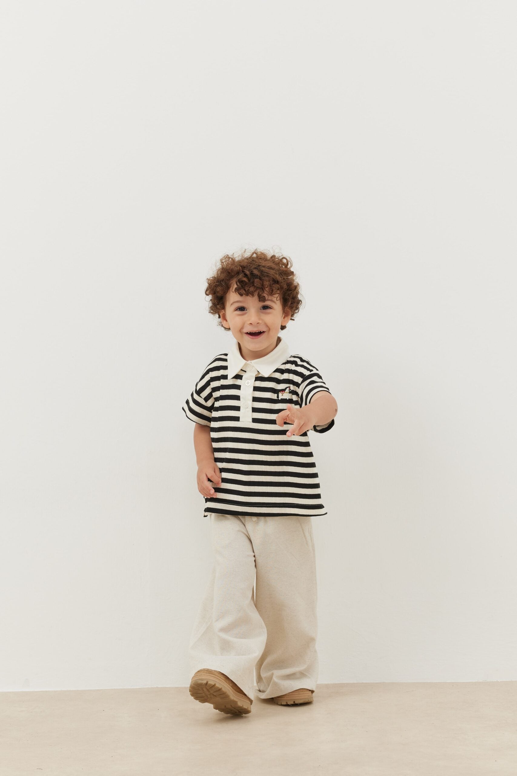 Bold striped black polo neck oversize t-shirt