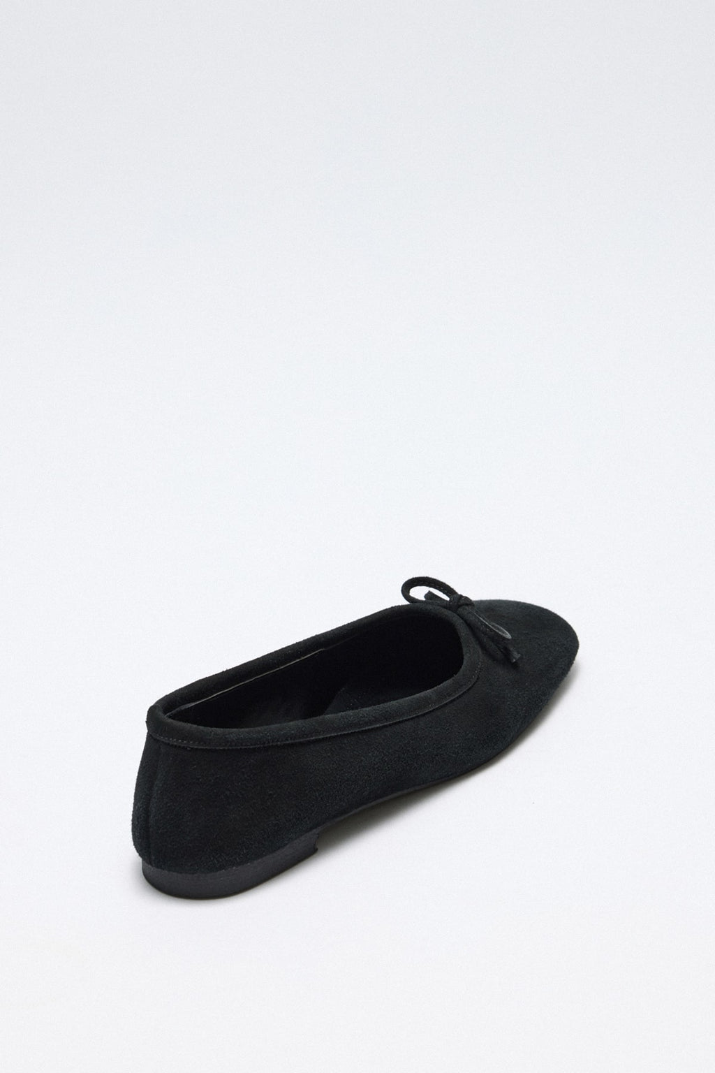 Black suede bow flats