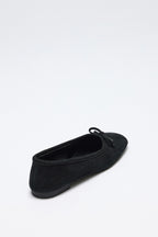 Black suede bow flats