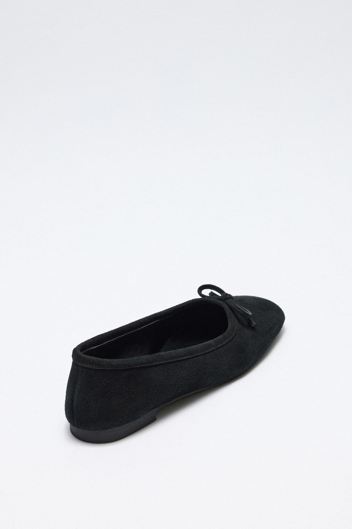 Black suede bow flats
