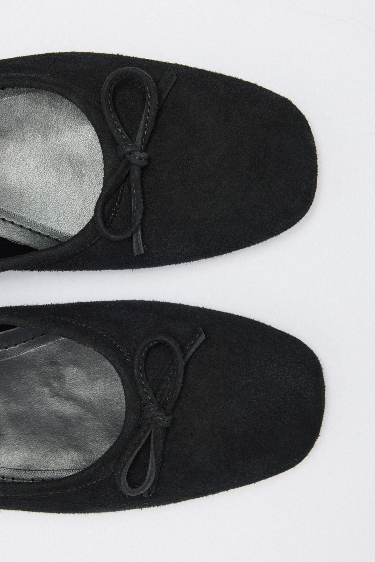 Black suede bow flats