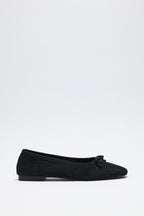 Black suede bow flats