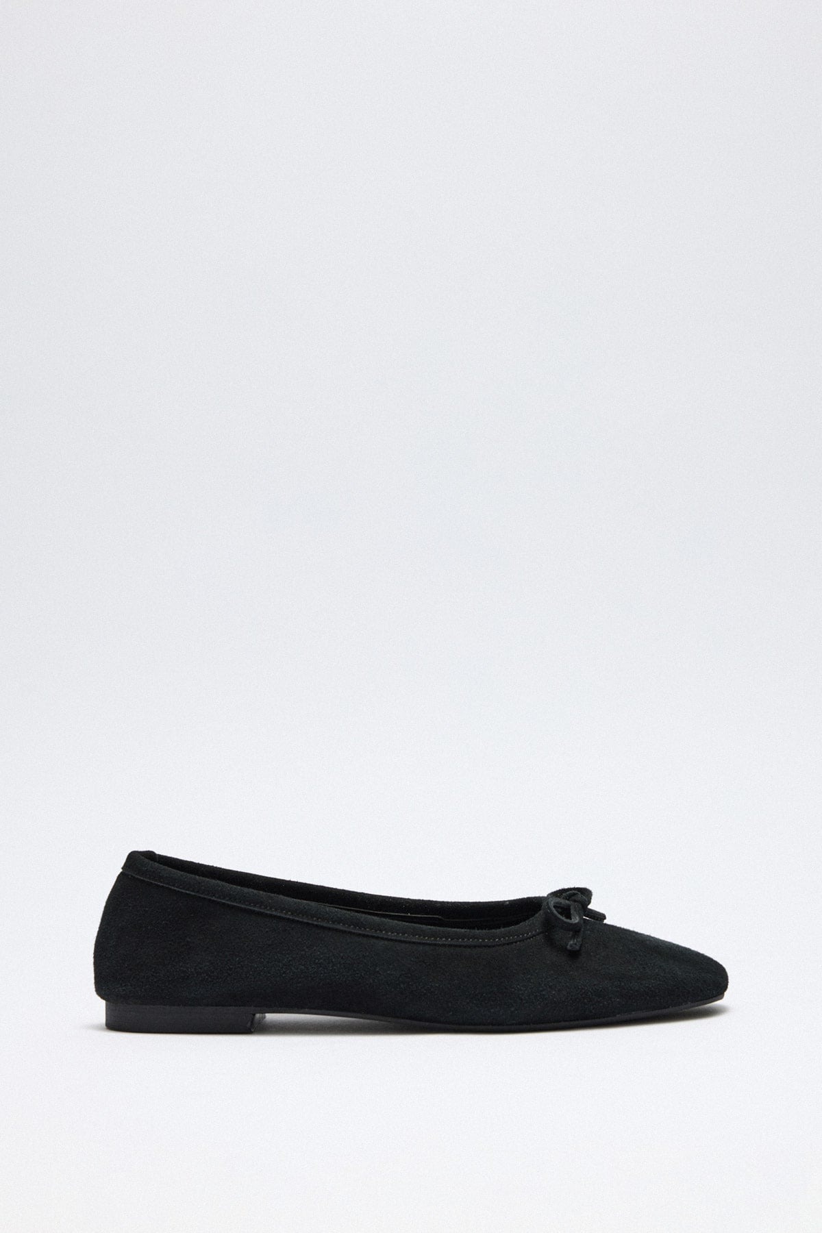 Black suede bow flats
