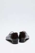 Dark brown low-heel strap flats