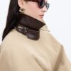 Camel trench coat with cape detail