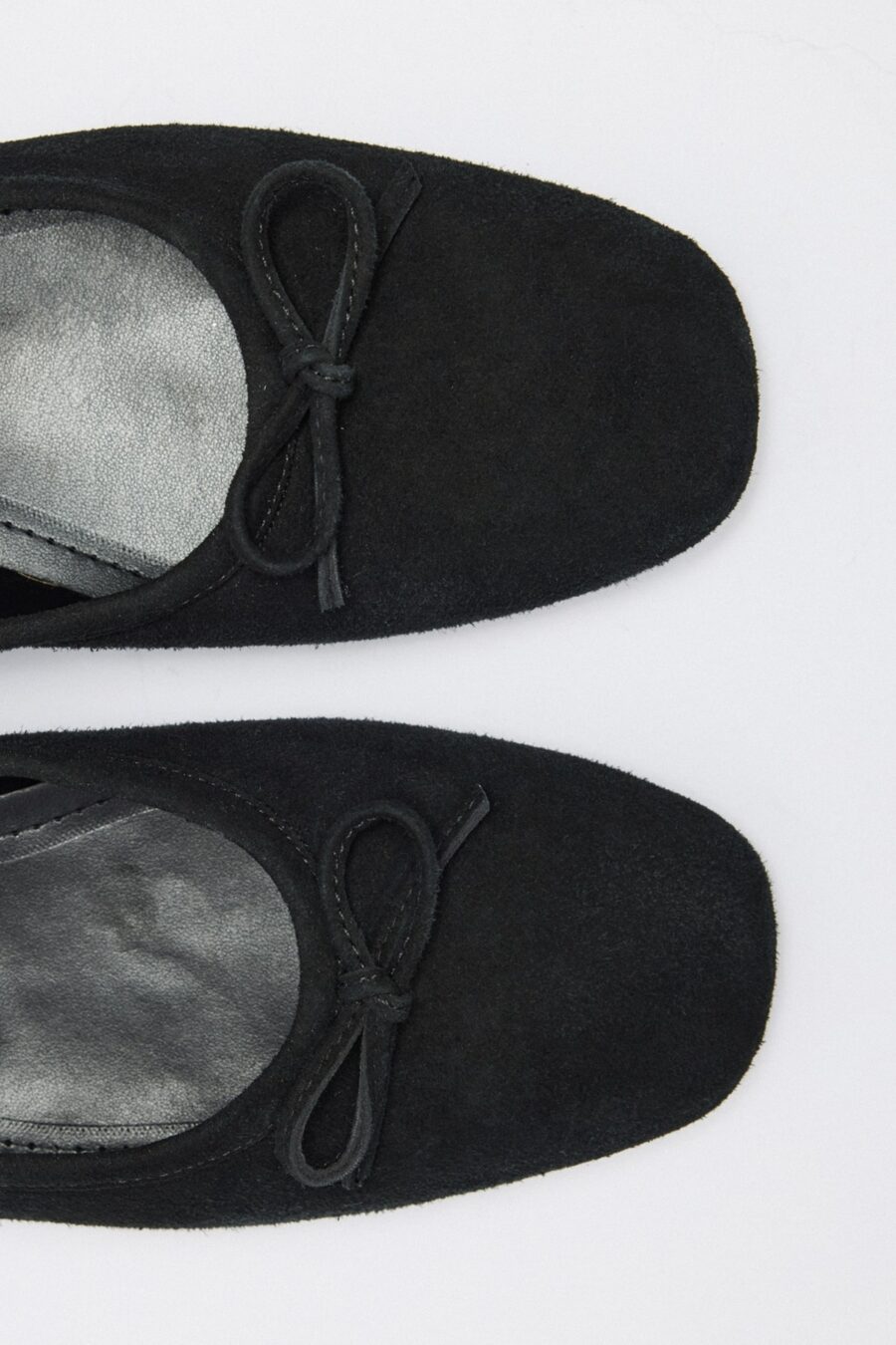 Black suede bow flats