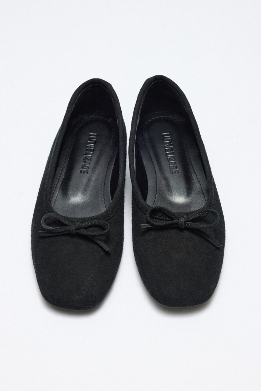 Black suede bow flats