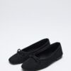 Black suede bow flats