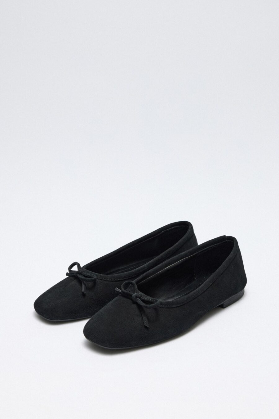 Black suede bow flats
