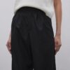 Black pleated palazzo trousers