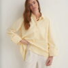 Butter yellow oversized button-detail shirt