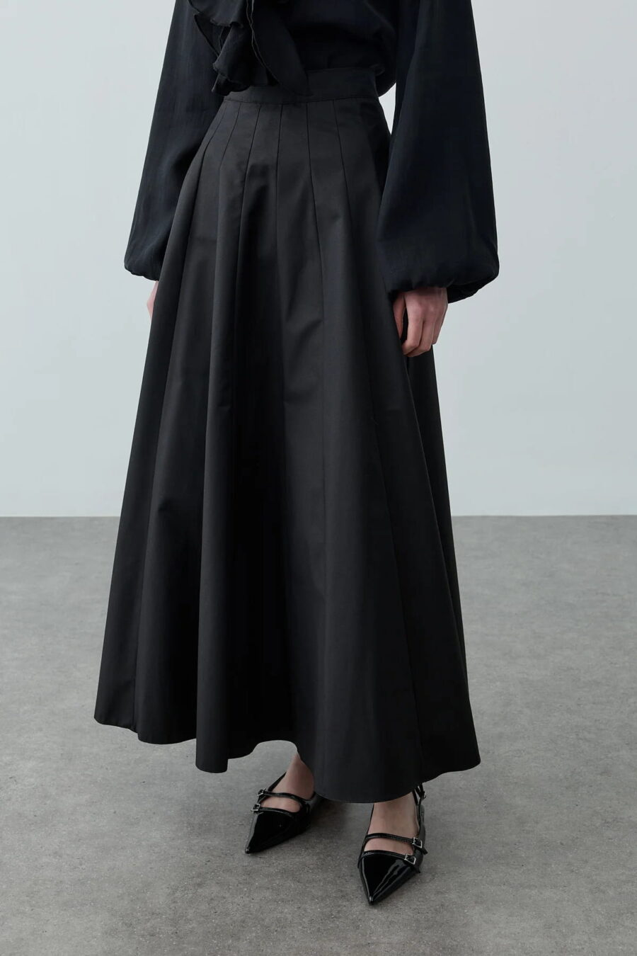 Black multi-piece godet skirt