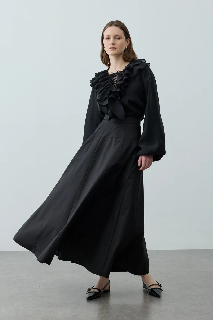 Black multi-piece godet skirt